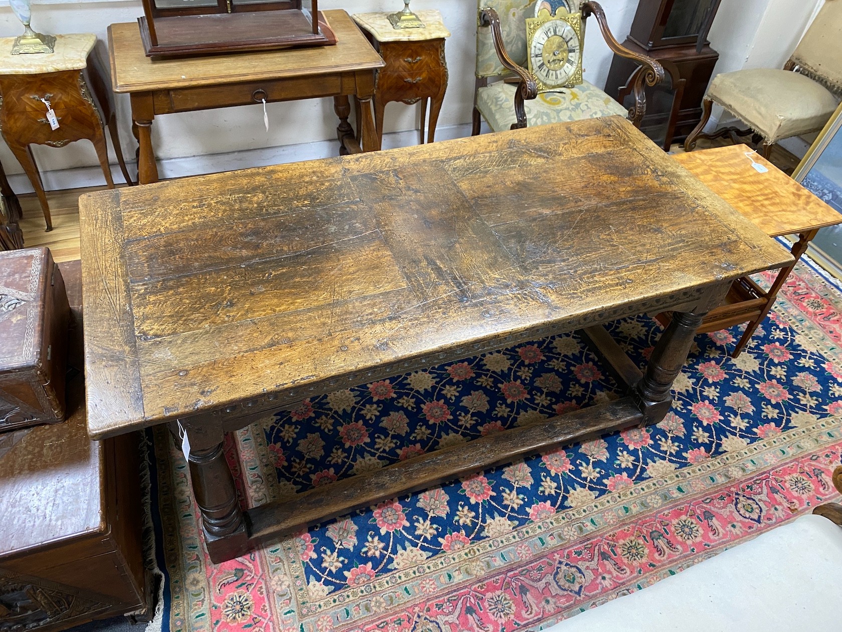 A mid 17th century oak refectory table, length 178cm, depth 84cm, height 75cm